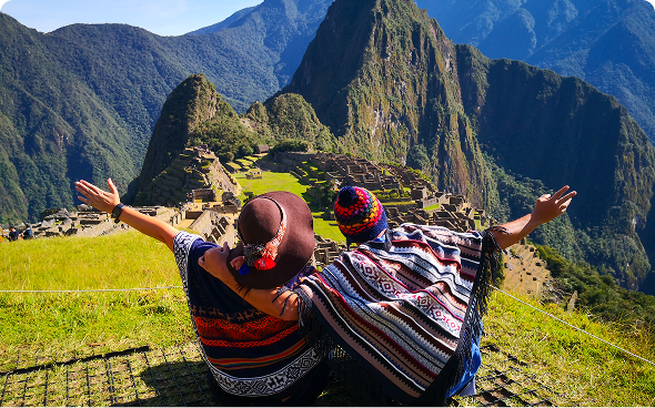 Travelers in colorful attire at Machu Picchu