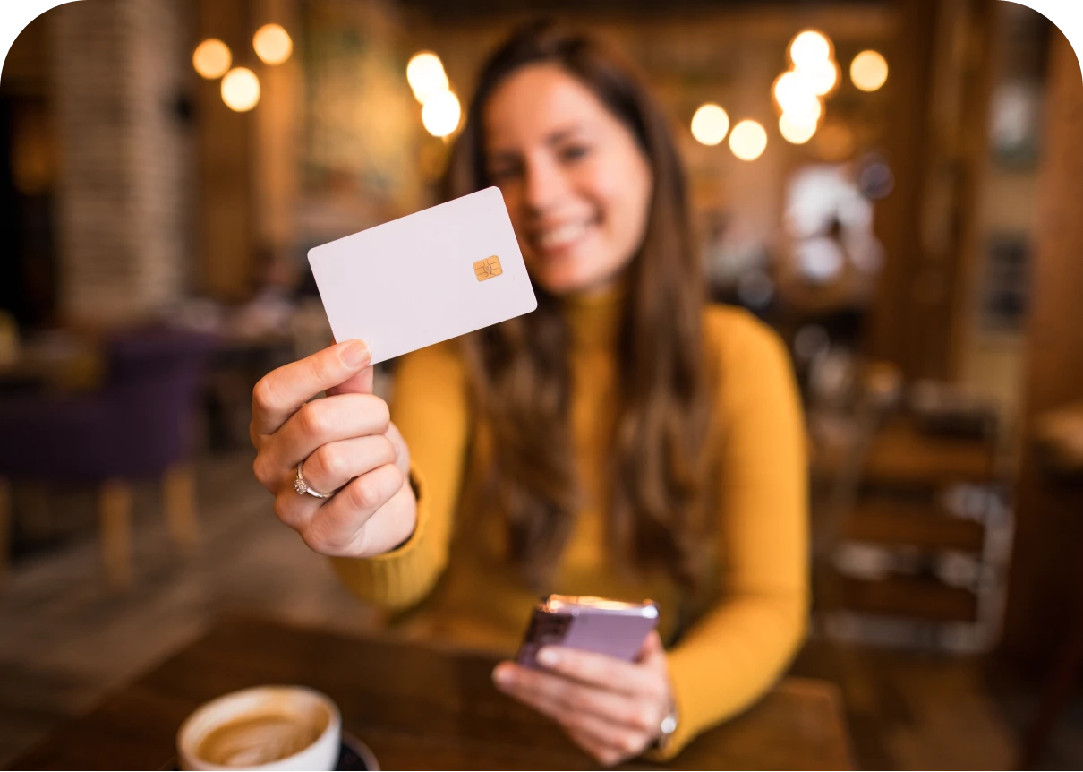 Smiling woman showing a card