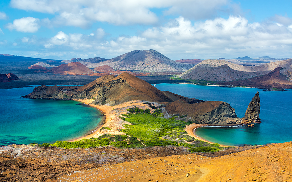 Volcanic island with sandy isthmus and turquoise bays